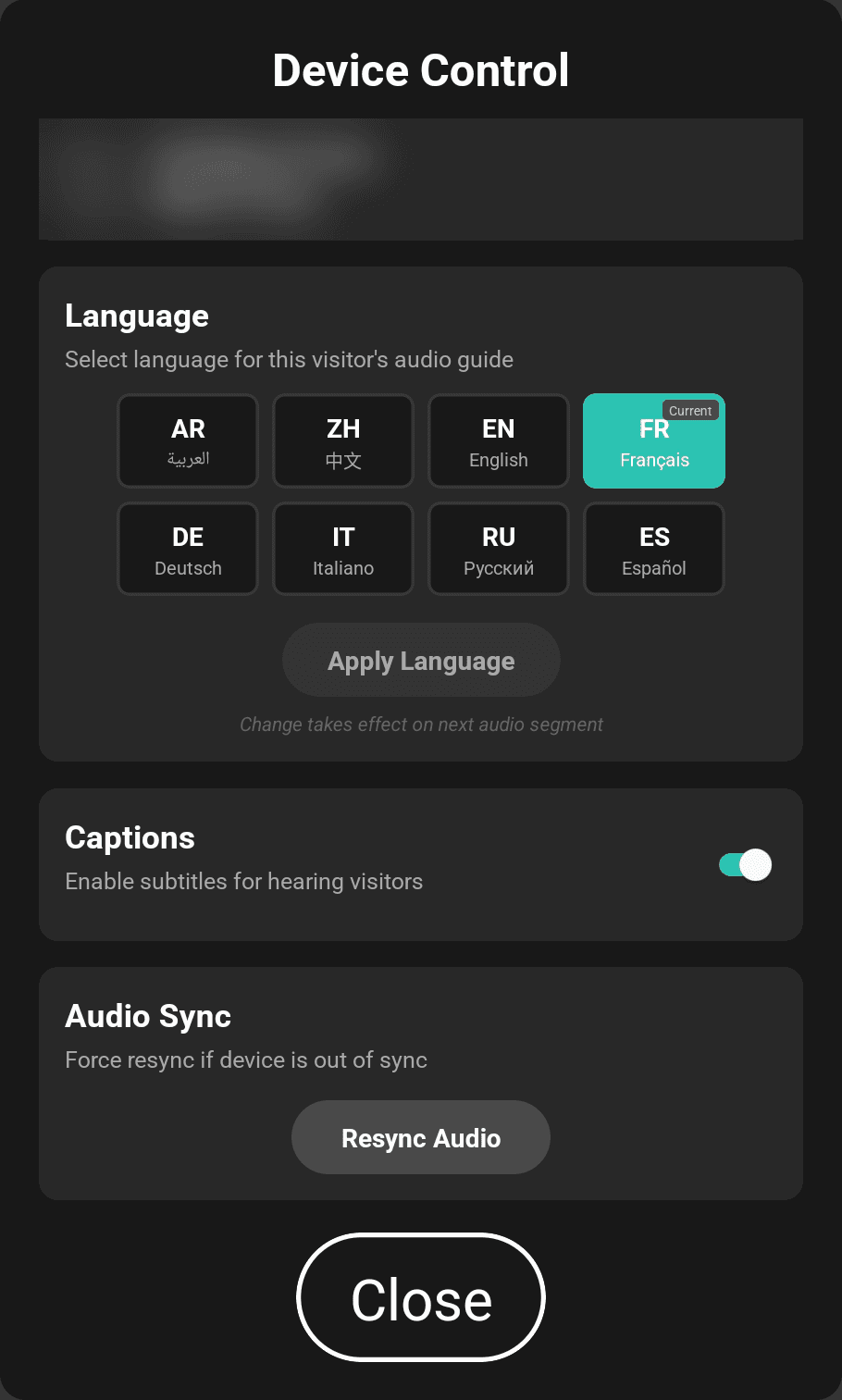Guide tablet Device Control panel with eight language options, a captions toggle switched on and a Resync Audio button. Device identifiers are blurred.