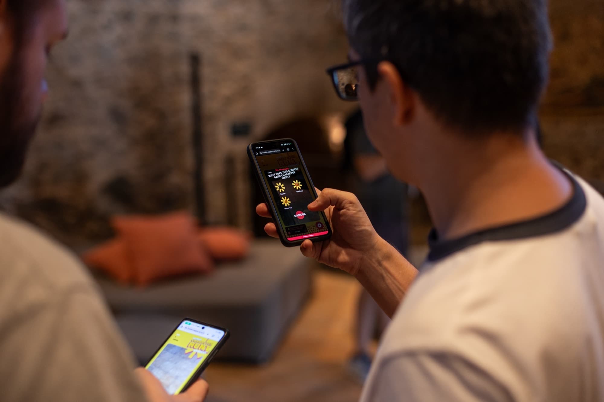 Indoor photo of a phone screen asking which prop a Scopely game character wants.